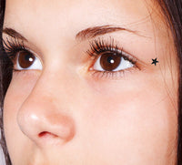 Schönheitsflecke Sterne Tattoos