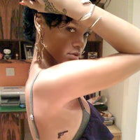 Rihanna - Revólver Tatuaje