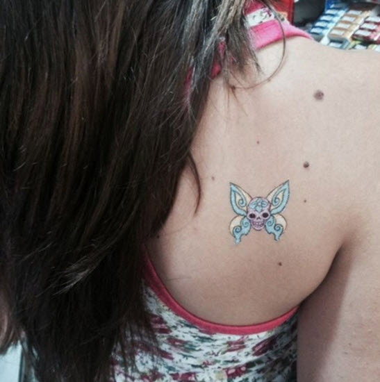Tatuaggio Di Teschio E Farfalla
