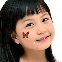 Small Brown Butterfly Tattoo