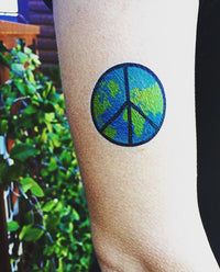 Weltfrieden Tattoo